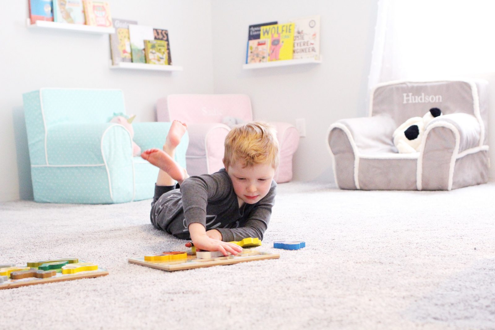 Kid playing on comfortable carpet floor