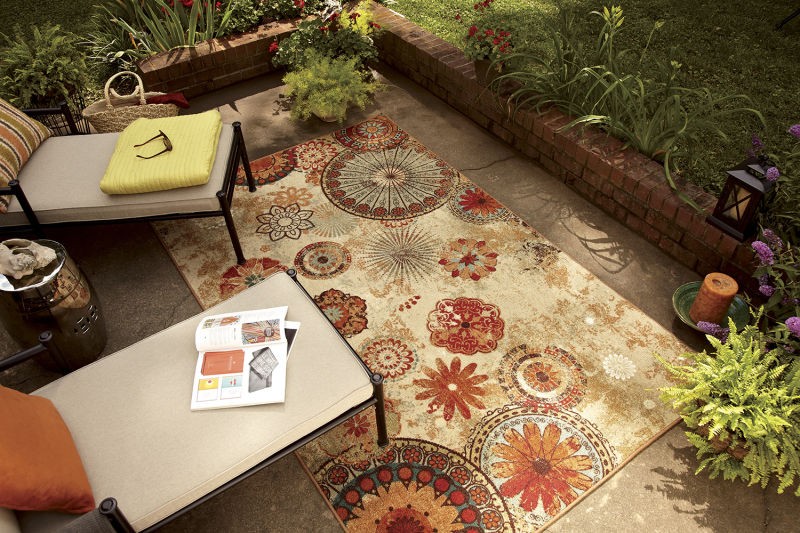 floral print area rug on outdoor patio