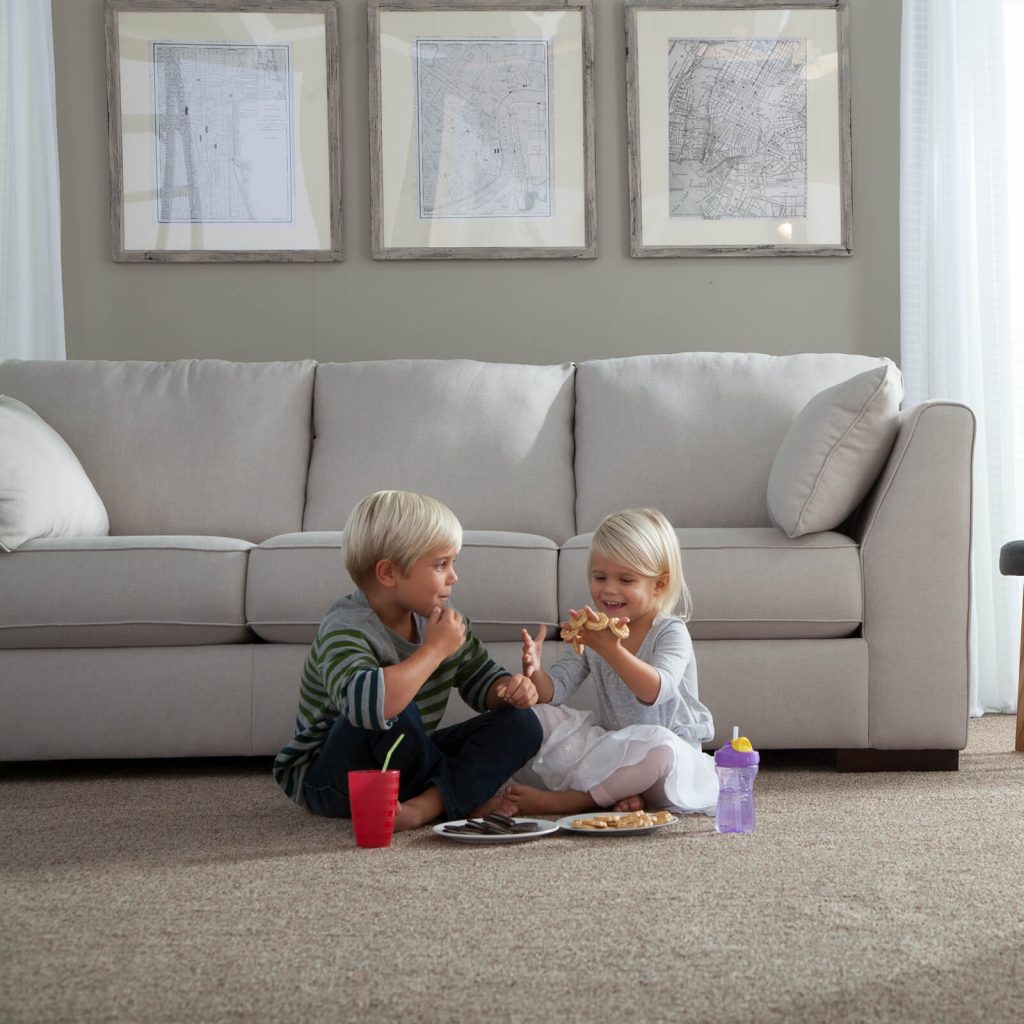 children sitting together on carpet