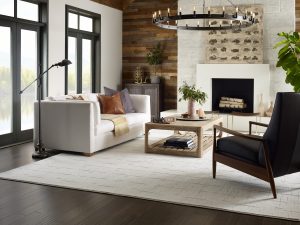 living room with accent wall and fireplace