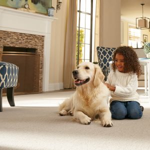 Kid with pet on carpet | Dolphin Carpet & Tile