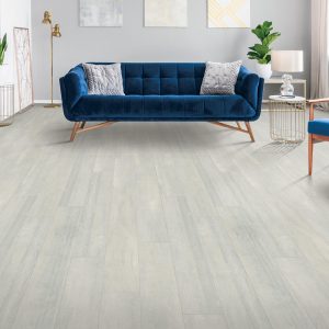 Blue couch on Laminate flooring | Dolphin Carpet & Tile