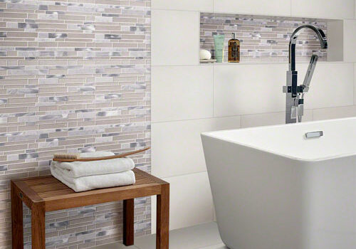 Large format Subway tile behind bathtub | Dolphin Carpet